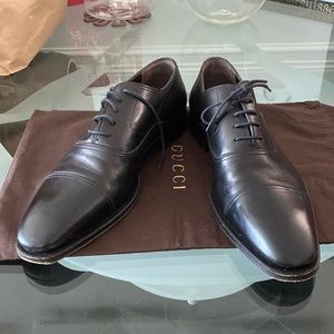 Gucci men’s black lace up dress shoes.